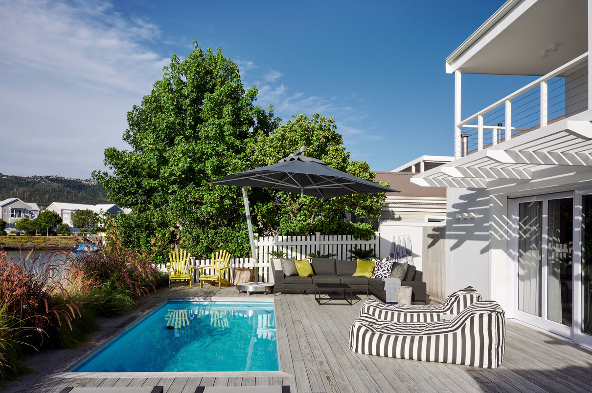 Studio Collective project — white two-storey home with timber pool deck